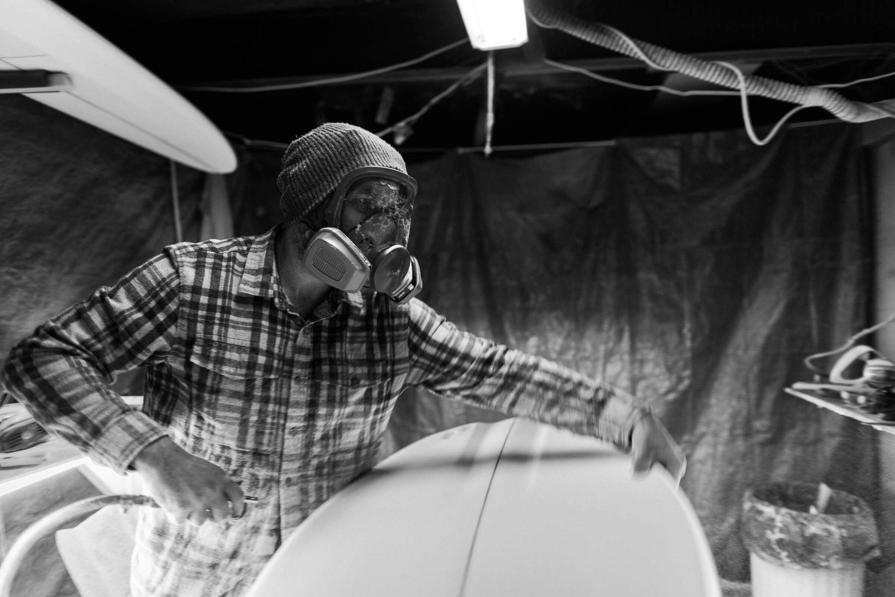 Nick shaping a board in the bay